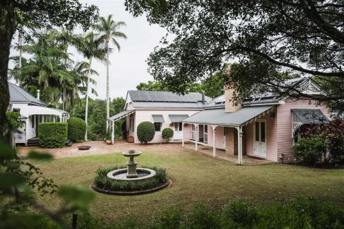 a house with a bird bath in the yard at Montville Estate - Luxury Hinterland Home & Pool in Montville