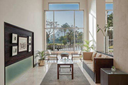 a living room with a couch and a table at Marriott Mena House, Cairo in Cairo