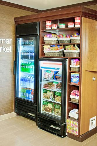 a refrigerator with its door open with food inside at Fairfield Inn and Suites San Bernardino in San Bernardino