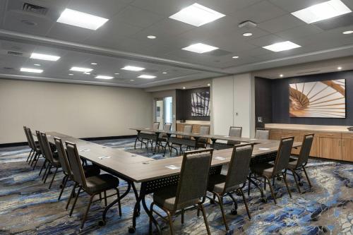 a conference room with a long table and chairs at Fairfield by Marriott Inn & Suites Coastal Carolina Conway in Conway