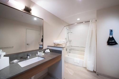 a bathroom with a sink and a tub and a shower at Fairfield Inn & Suites by Marriott Oklahoma City El Reno in El Reno