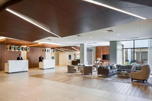a lobby with couches and chairs in a building at North Charleston Marriott in Charleston