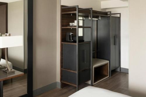 a room with a closet with a glass door at North Charleston Marriott in Charleston