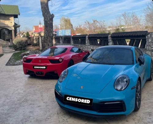 two cars parked next to each other at Royal Casa in Belgrade