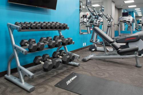 a gym with two tread machines in a room at Fairfield Inn & Suites by Marriott New York Queens/Fresh Meadows in Queens