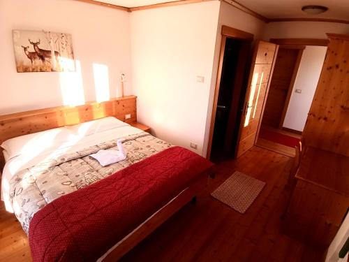 Postel nebo postele na pokoji v ubytování Rifugio Predaia Ai Todes'ci