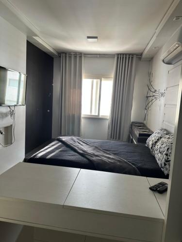 Ένα ή περισσότερα κρεβάτια σε δωμάτιο στο Coração de Capão