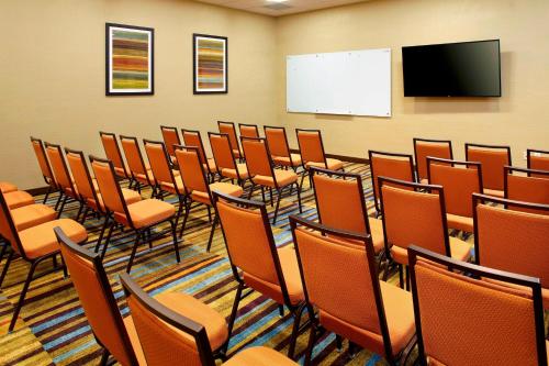 a conference room with chairs and a whiteboard at Fairfield by Marriott Inn & Suites Wheeling at The Highlands in Triadelphia