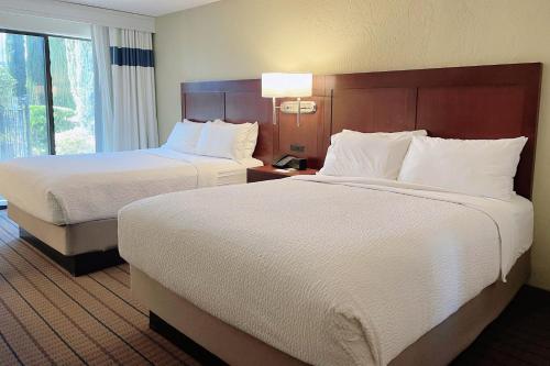 a hotel room with two beds and a window at Four Points by Sheraton San Rafael Marin County in San Rafael