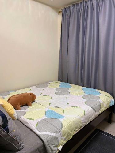 Llit o llits en una habitació de Shore Residences C1