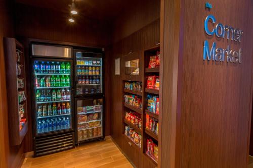 a store aisle with two refrigerators and drinks at Fairfield Inn & Suites by Marriott Geneva Finger Lakes in Geneva