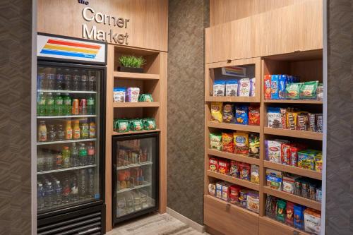 a store aisle with two refrigerators and drinks at Fairfield Inn & Suites Vero Beach in Vero Beach
