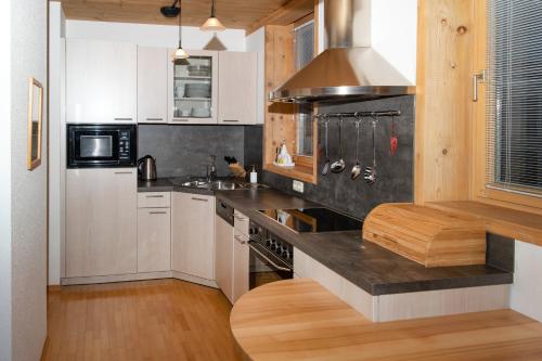 Kuchyň nebo kuchyňský kout v ubytování tannberg LODGE