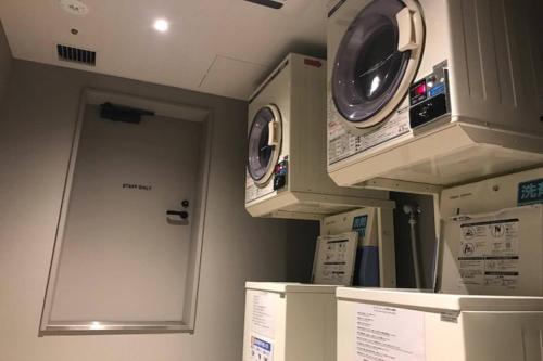a hospital room with two washing machines on display at Fairfield by Marriott Osaka Namba in Osaka