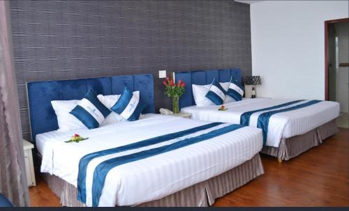 Postel nebo postele na pokoji v ubytování Pho Nui Hotel