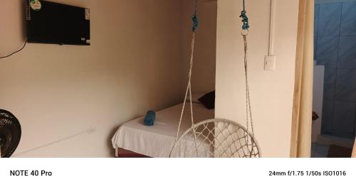 Un televizor și/sau centru de divertisment la Hostal Oasis