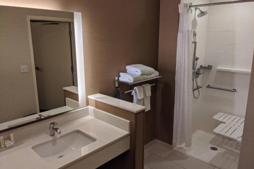 a bathroom with a sink and a shower at Fairfield Inn & Suites by Marriott Phoenix Tempe/Airport in Tempe
