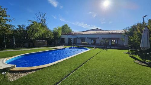 a swimming pool in the yard of a house at Neferprod Apartments - IS - CAM 08 in Timişoara