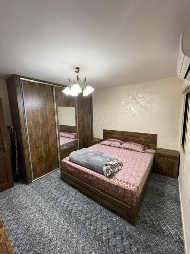 Postel nebo postele na pokoji v ubytování Toum's Apartments