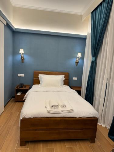 Postel nebo postele na pokoji v ubytování Modi Hotel