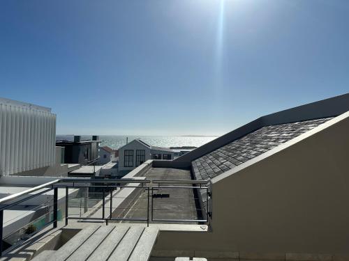 a view from the roof of a building with stairs at Blouberg Village Place in Cape Town