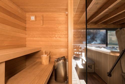 a sauna with a trash can and a sink at Locanda Zita in Sestola