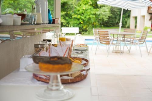 a table with a tray of food on a counter at Haute Haus - Guest House in Florianópolis