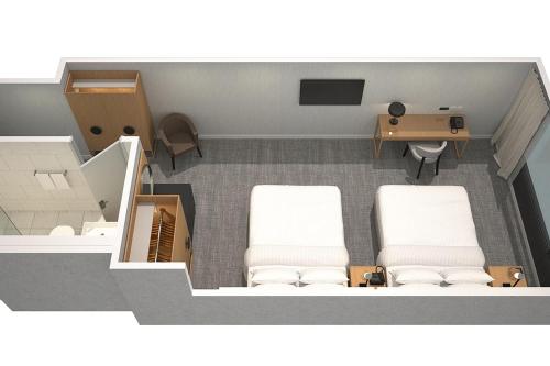 an overhead view of a hospital room with two beds and a desk at Four Points by Sheraton Sydney, Central Park in Sydney