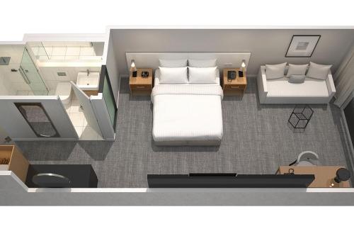 a floor plan of a bedroom with a bed at Four Points by Sheraton Sydney, Central Park in Sydney