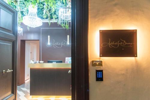 a entrance to a salon with a sign on the door at Adelaide Suite Dreams in Rome