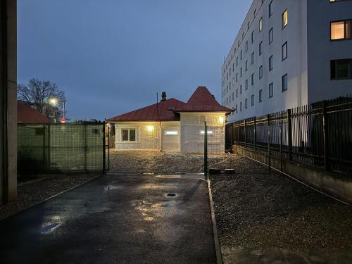 an empty parking lot in front of a building at DreamPlace Airport & Therme 2 in Otopeni