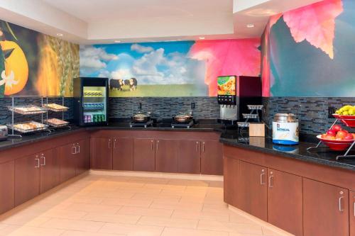 a kitchen with a counter with food on it at Fairfield Inn & Suites Lubbock in Lubbock