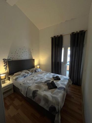 Katil atau katil-katil dalam bilik di Apartman Viktoria