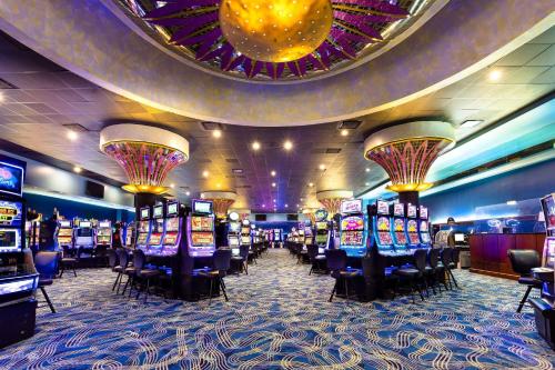 a casino with a bunch of slot machines at Four Points by Sheraton Caguas Real in Caguas