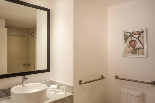 a bathroom with a sink and a mirror at Fairfield Inn & Suites Queretaro Juriquilla in Querétaro