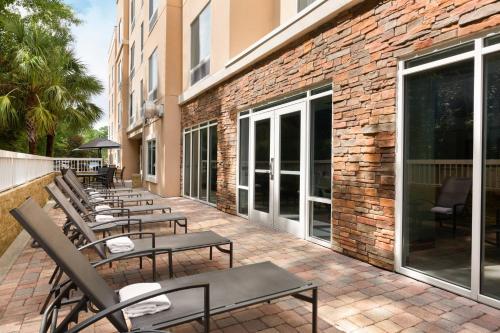 a row of benches sitting outside of a building at Fairfield Inn & Suites Jacksonville West/Chaffee Point in Jacksonville