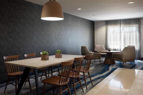 a waiting room with two tables and chairs at Fairfield Inn & Suites Redding in Redding