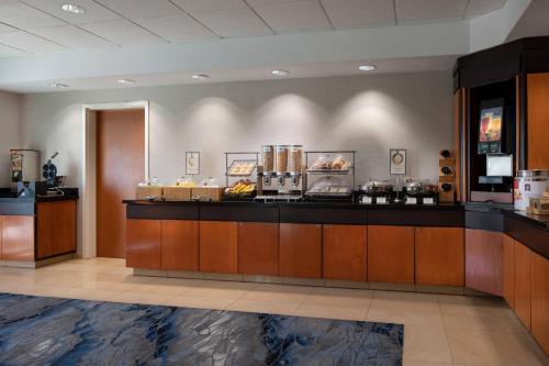a lobby with a counter with food on it at Fairfield Inn & Suites Redding in Redding