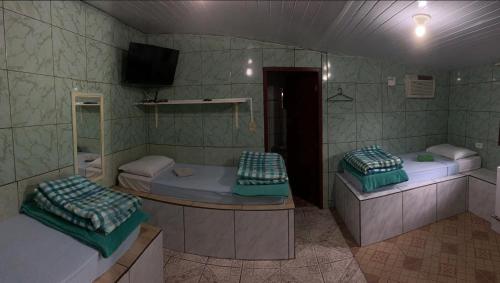 Postel nebo postele na pokoji v ubytování Pousada do Nereu