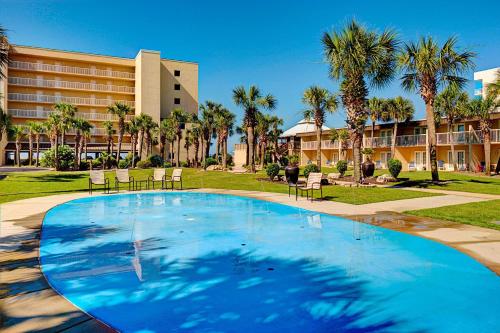 a large swimming pool in front of a resort at Four Points by Sheraton Destin - Fort Walton Beach in Fort Walton Beach
