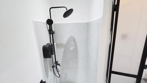 a shower in a bathroom with a shower curtain at Oasis Moods Holiday Homes in Al Ain