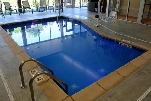a swimming pool with blue water in a building at Fairfield Inn & Suites By Marriott Somerset in Somerset