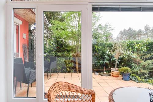 an open door to a patio with a table and chairs at Wellenreiter in Stahlbrode
