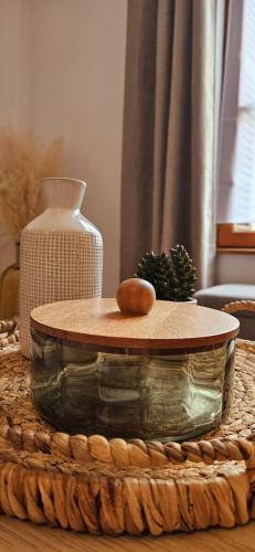 a table with a glass bowl on top of it at Fresh Cotton, 5mn from ZooParc de Beauval in Saint-Aignan