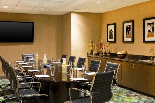 a conference room with a long table and chairs at Four Points by Sheraton Tucson Airport in Tucson
