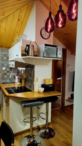 a kitchen with a counter and some pots and pans at Zakątek u Poety Dąbrówka in Jasło