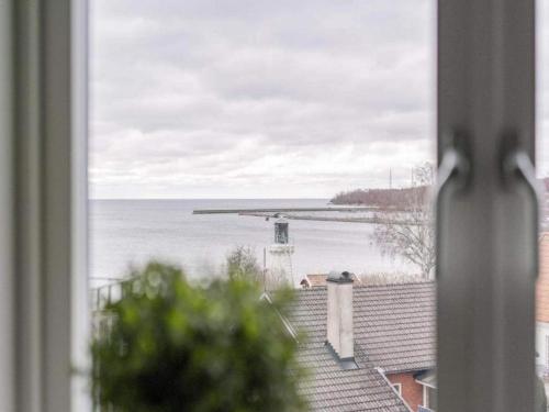 a view of the ocean from a window at Studio with Terrace in Sölvesborg in Sölvesborg
