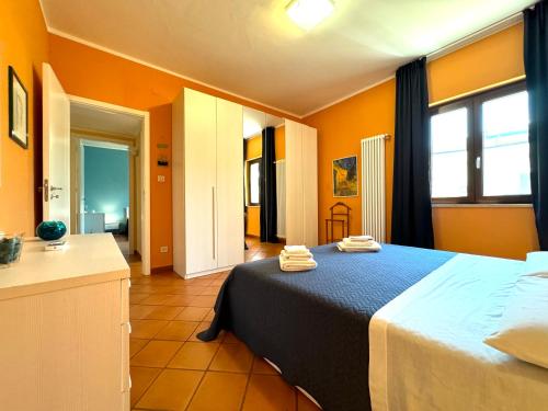 a bedroom with a bed with two towels on it at Casa di Mami in Capaci