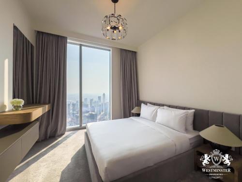 Ένα ή περισσότερα κρεβάτια σε δωμάτιο στο Westminster Forte Burj Khalifa