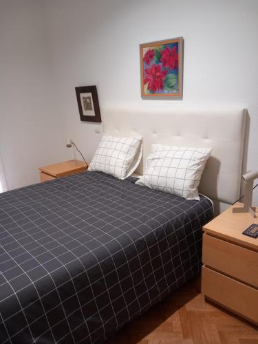 Ένα ή περισσότερα κρεβάτια σε δωμάτιο στο Apartamento Amazónico en Aranjuez